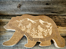 Handcrafted, CNC-carved bear-shaped hard maple cribbage board, artisan-made in Montana, Mountain wildflower scene 