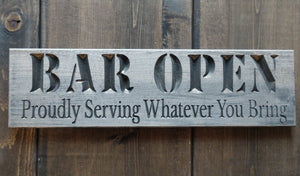 Knotty Pine Woodworks Bar Open proudly serving whatever you bring, grey carved sign