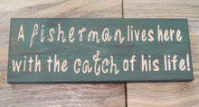 Fisherman lives here with the catch of his life